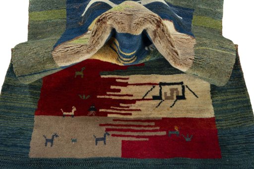 Corner detail of 2000s Persian Gabbeh rug showing border pattern and Wool pile