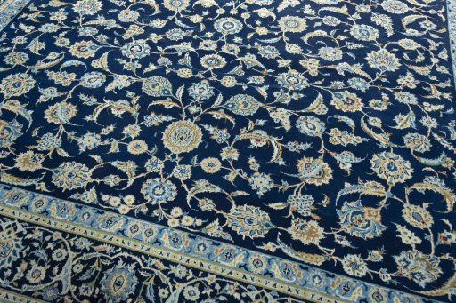 Close-up detail of 2000s Kashan rug from Iran / Persia showing Wool weave
