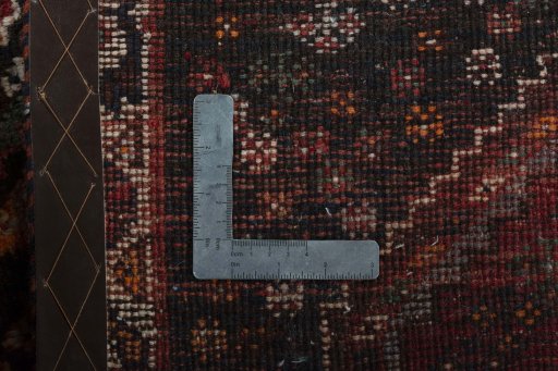 Surface texture of 2000s Shiraz rug with natural Wool and intricate pattern