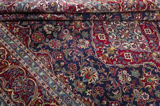 Close-up detail of 2000s Kashan rug from Iran / Persia showing Wool weave