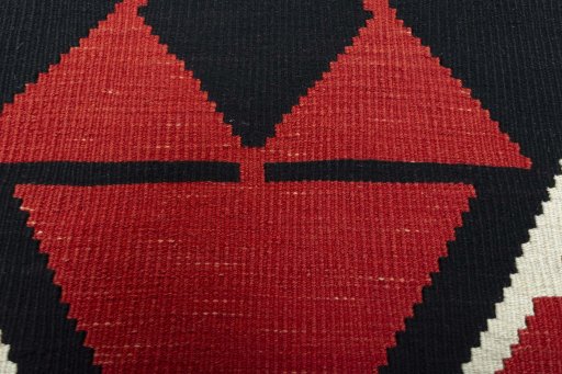 Backside of handmade New Modern Design rug showing knot structure and weave density
