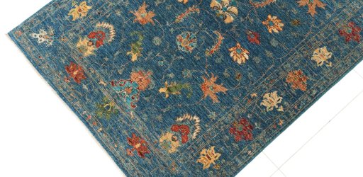 Backside of handmade New Farahan rug showing knot structure and weave density