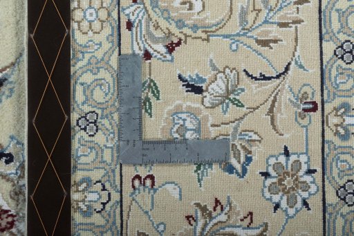 Backside of handmade 2000s Nain rug showing knot structure and weave density