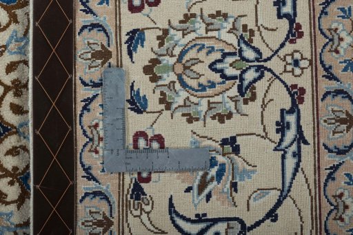 Backside of handmade 2000s Nain rug showing knot structure and weave density