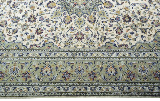 Corner detail of 2000s Kashan rug showing border pattern and Wool pile