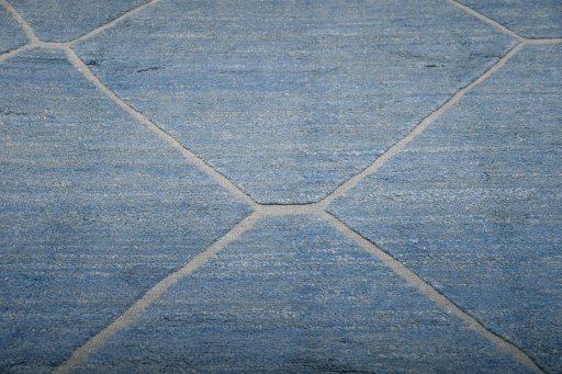 Backside of handmade New Morocco rug showing knot structure and weave density
