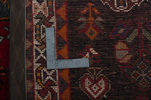 Surface texture of 2000s Shiraz rug with natural Wool and intricate pattern