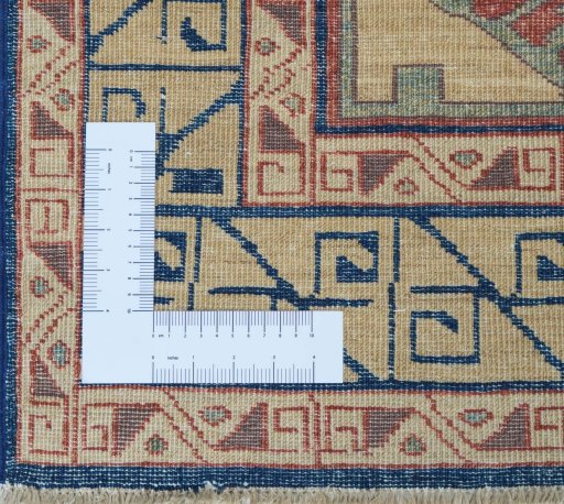 Corner detail of New Kazak rug showing border pattern and Wool pile