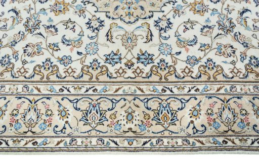 Corner detail of New Kashan rug showing border pattern and Wool pile