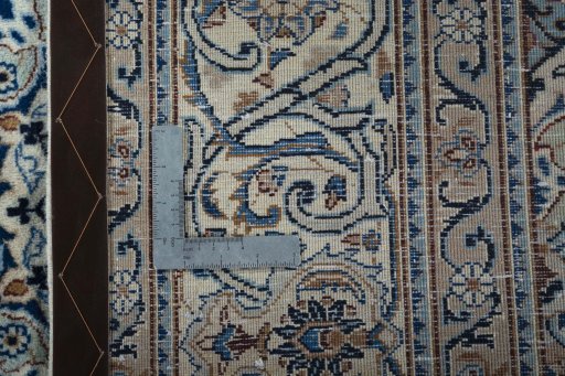 Backside of handmade 2000s Kashmar rug showing knot structure and weave density