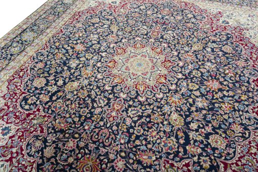 Backside of handmade 1970s Kerman rug showing knot structure and weave density