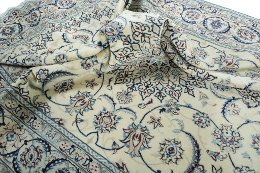 Surface texture of 2000s Nain rug with natural Wool and intricate pattern