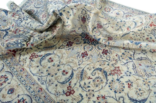 Surface texture of 2000s Nain rug with natural Wool and intricate pattern