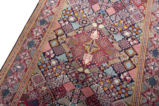 Backside of handmade 2000s Kashan rug showing knot structure and weave density