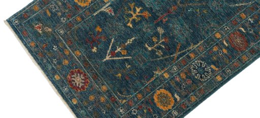 Backside of handmade New Farahan rug showing knot structure and weave density