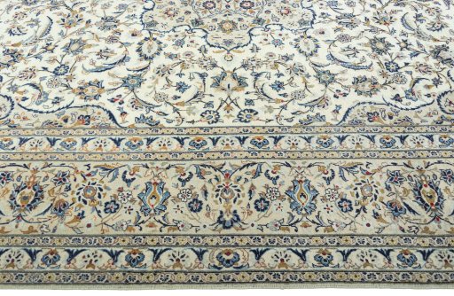 Corner detail of 2000s Kashan rug showing border pattern and Wool pile