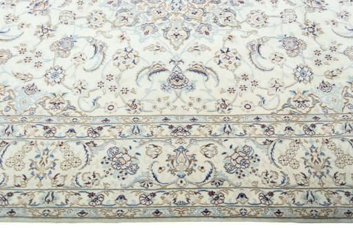 Corner detail of 2000s Nain rug showing border pattern and Wool pile