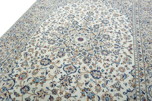 Backside of handmade 2000s Kashan rug showing knot structure and weave density
