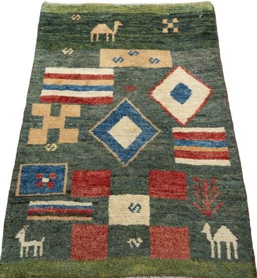 Surface texture of 2000s Persian Gabbeh rug with natural Wool and intricate pattern