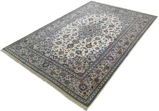 Corner detail of 2000s Kashan rug showing border pattern and Wool pile