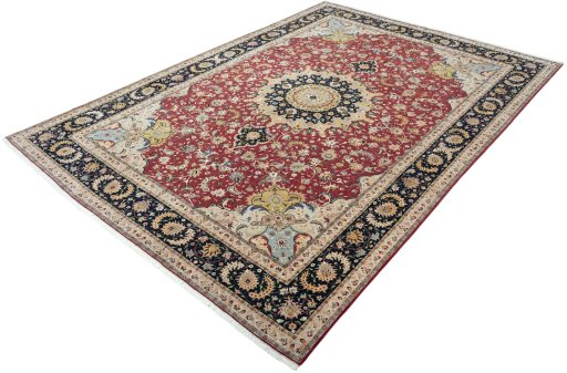 Corner detail of 2000s Tabriz 50/60/70 Raj rug showing border pattern and Cork pile