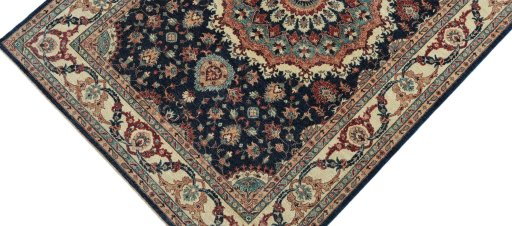 Backside of handmade New Farahan rug showing knot structure and weave density