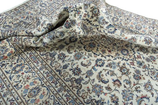 Surface texture of 2000s Kashan rug with natural Wool and intricate pattern