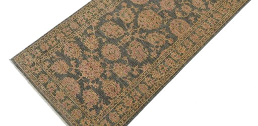 Backside of handmade New Farahan rug showing knot structure and weave density