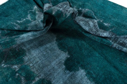 Surface texture of 1970s Vintage rug with natural Wool and intricate pattern