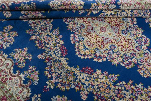 Close-up detail of 1970s Kerman rug from Iran / Persia showing Wool weave
