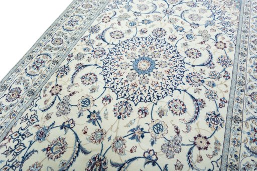 Backside of handmade New Nain rug showing knot structure and weave density