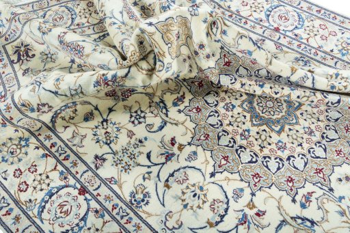 Surface texture of 2000s Nain rug with natural Wool and intricate pattern