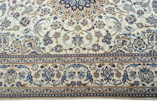 Corner detail of 2000s Nain rug showing border pattern and Wool pile