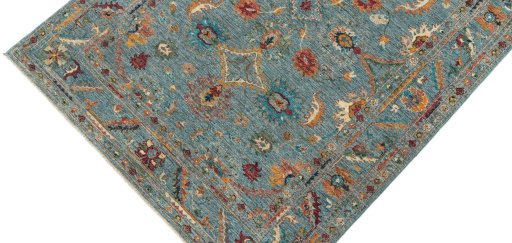 Backside of handmade New Farahan rug showing knot structure and weave density