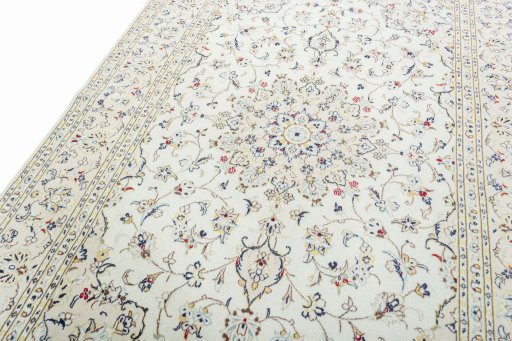 Backside of handmade 2000s Kashan rug showing knot structure and weave density