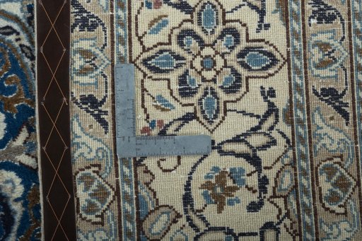 Backside of handmade 2000s Nain rug showing knot structure and weave density