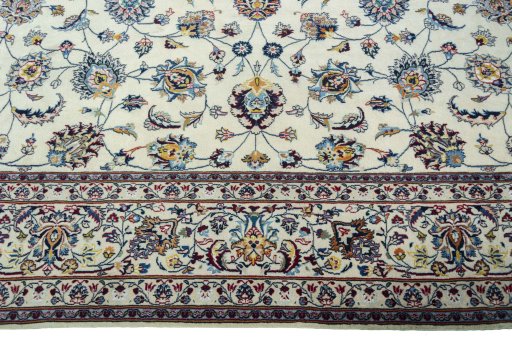 Corner detail of 2000s Mashad rug showing border pattern and Wool pile