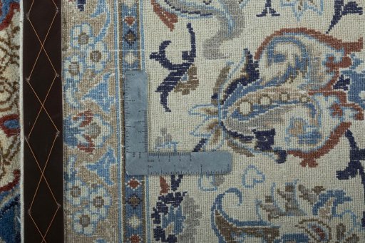 Backside of handmade 2000s Nain rug showing knot structure and weave density