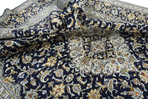 Surface texture of 2000s Kashan rug with natural Wool and intricate pattern