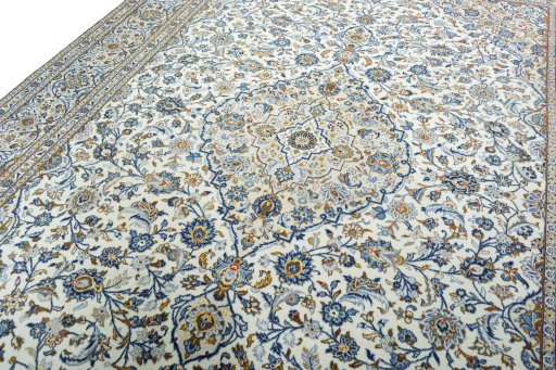 Backside of handmade 2000s Kashan rug showing knot structure and weave density