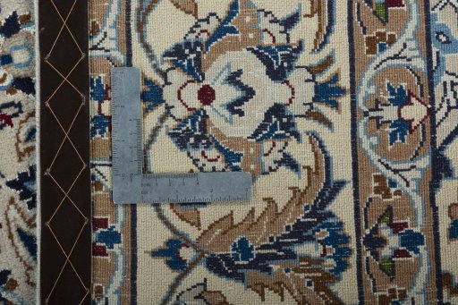 Backside of handmade 2000s Nain rug showing knot structure and weave density