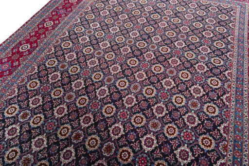 Backside of handmade 2000s Mashad rug showing knot structure and weave density