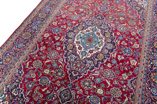 Backside of handmade New Kashan rug showing knot structure and weave density