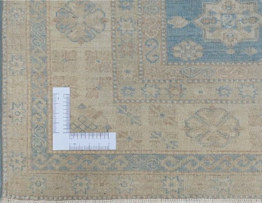 Corner detail of New Kazak rug showing border pattern and Wool pile