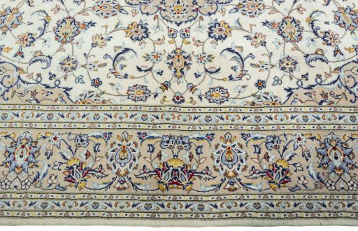 Corner detail of 2000s Kashan rug showing border pattern and Wool pile