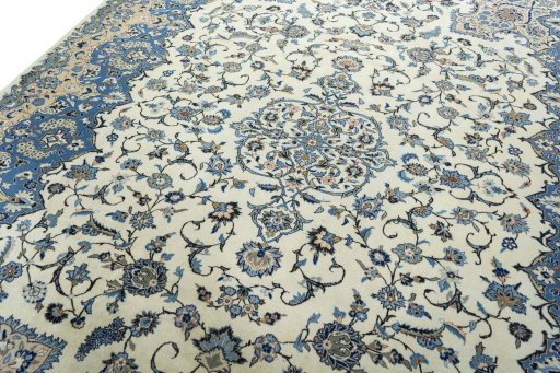 Backside of handmade 2000s Kashan rug showing knot structure and weave density
