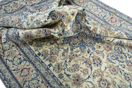 Surface texture of 2000s Nain rug with natural Wool and intricate pattern