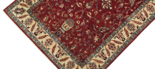 Backside of handmade New Farahan rug showing knot structure and weave density
