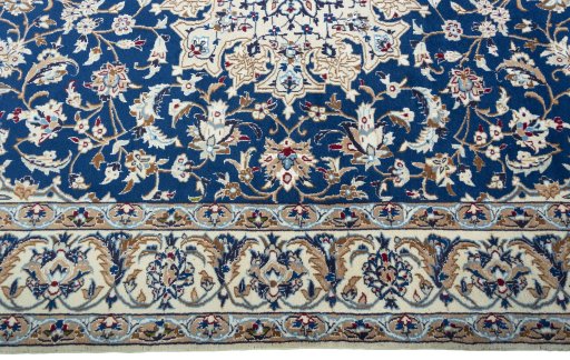 Corner detail of 2000s Nain rug showing border pattern and Wool pile