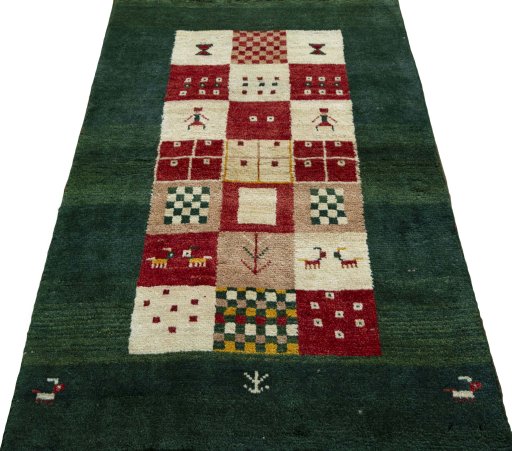 Surface texture of 2000s Persian Gabbeh rug with natural Wool and intricate pattern